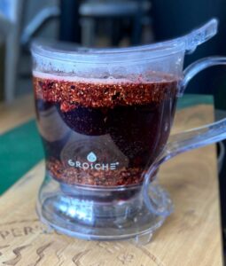 Grosche tea steeper full of summer berry tea and water