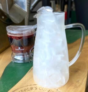 Pitcher of ice and a Grosche tea steeper full of Summer Berry Tea