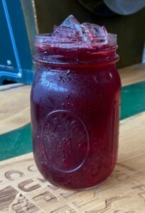 Mason jar of ice and summer berry tea