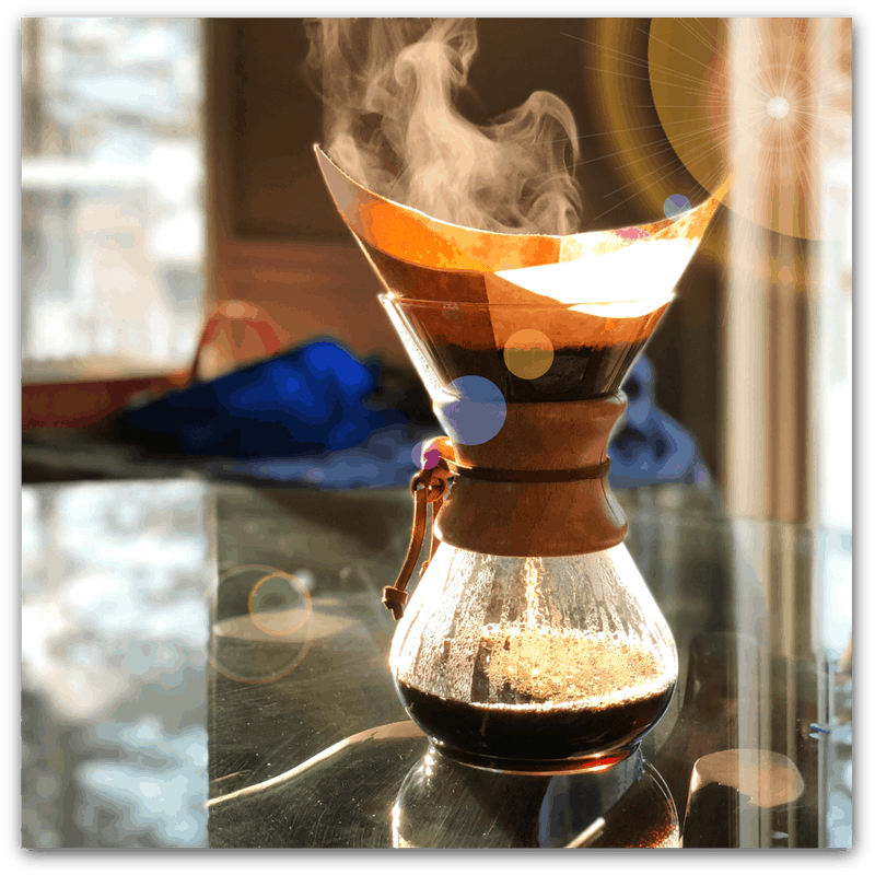 Chemex coffee pour-over steaming in the sun