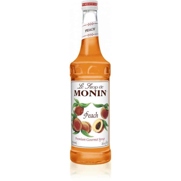 monin peach syrup in glass bottle