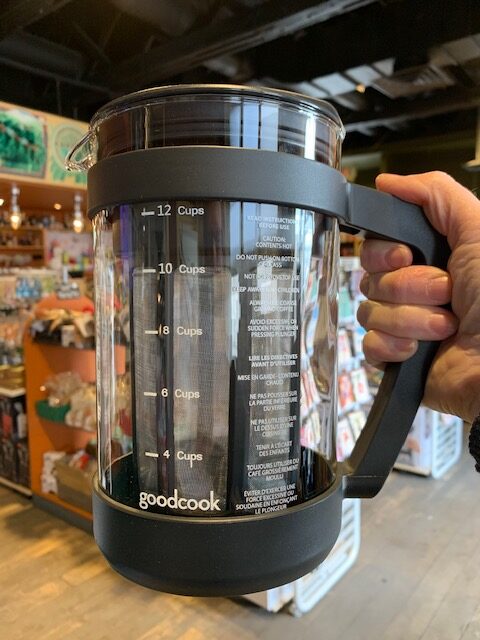 Hand holding a Cold coffee press brewer