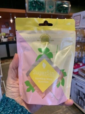 SugarSin Sparkling Wine Gummies candy in a bag at Cupper's