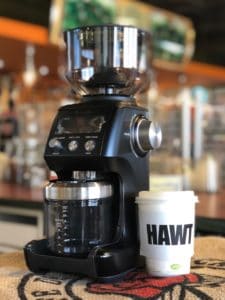 Breville smart grinder pro in black with coffee cup