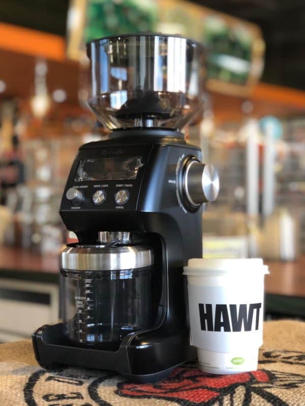 Breville smart grinder pro in black with coffee cup