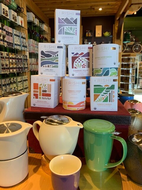 A stack of colourful boxes of different Rishi Teas To Make Your Café More Sustainable