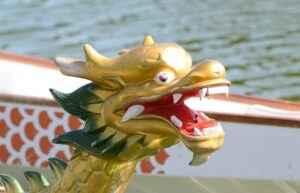 Dragon head in front of a dragon boat