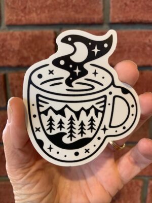 vinyl sticker of a hot mug with mountains on it