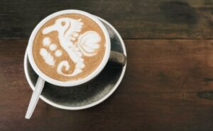 Sea horse coffee latte art on a mug