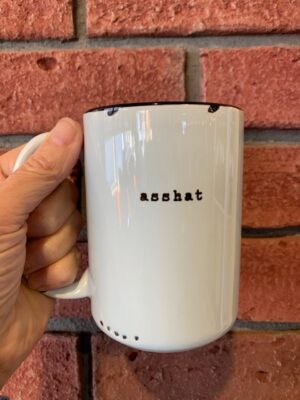 Blue mug with asshat on it