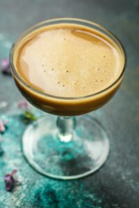 Espresso martini in a glass for a cocktail recipe.