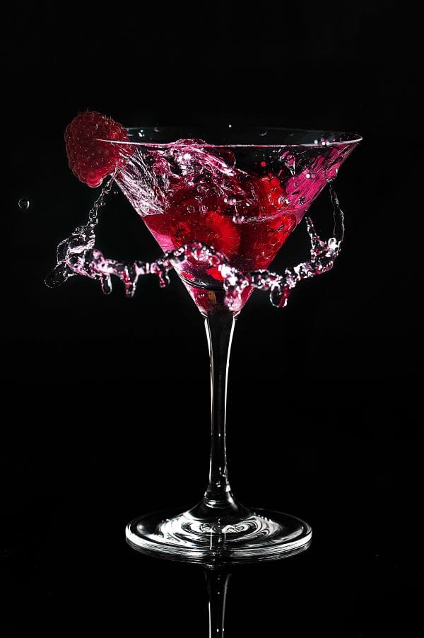 Raspberry Cosmopolitan splashing for a cocktail recipe.