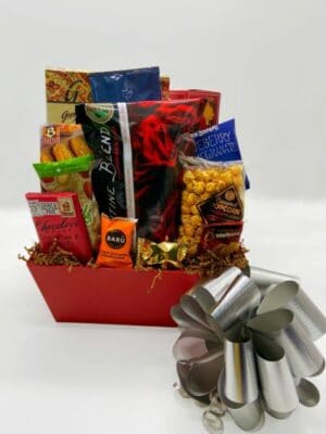 Valentines Basket Medium includes coffee, tea, and sweet treats in a red basket and silver bow.