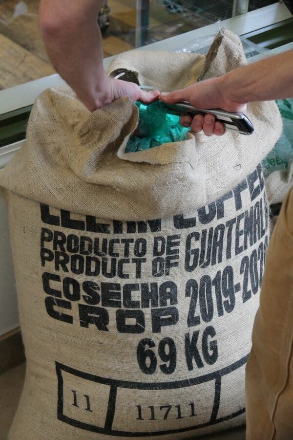 a burlap bag of green coffee beans