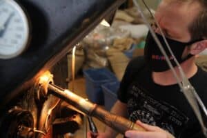 Master coffee roaster Josh checking the coffee during a roast