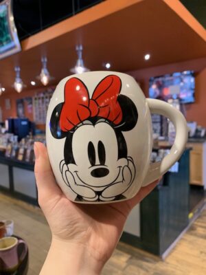 Minnie Mouse mug with red bow on a white background.