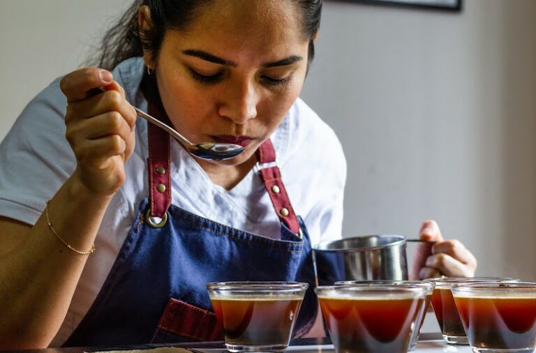 woman cupping or taste testing coffees