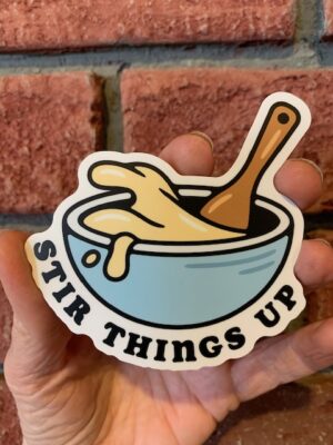 sticker stir things up above a splashing bowl and spoon