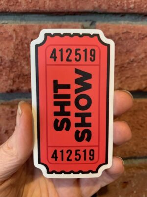 sticker shit show on a movie ticket in red
