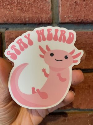 sticker with pink axolotl saying stay weird