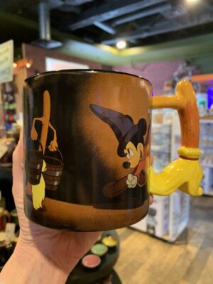 The front of Walt Disney's Fantasia Mugwith Mickey Mouse as the sorcerer's apprentice, and the magic broom as the handle