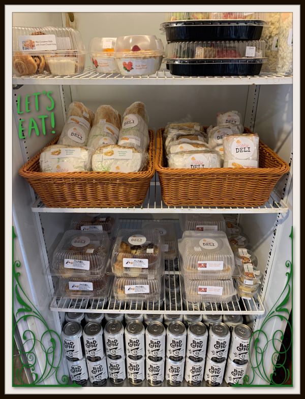 Deli Fridge with sandwiches, pasta salad, yogurt parfaits, snacks, treats, and Bad Coffee Nitro Cans