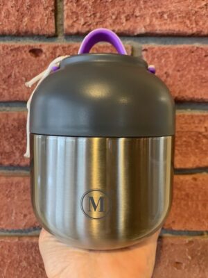 Thermal Food Jar Classic, 500 mL is brushed metal and a plastic bowl lid. The lid has a pink & purple handle.