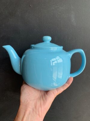 Vivian Teal Windsor Teapot being held up