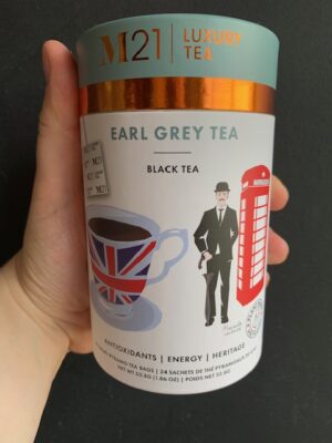 M21 Earl Grey Tea being held by a hand