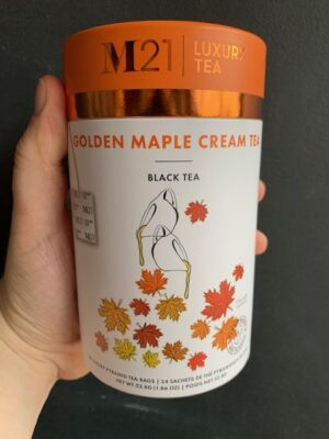 M21 Golden Maple Cream Tea being held by a hand