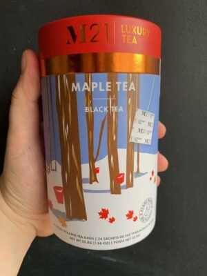 M21 Maple Tea being held by a hand