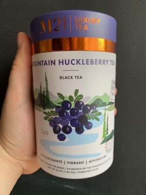 M21 Canadian Huckleberry Tea being held by a hand