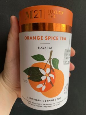 M21 Orange Spice Tea being held by a hand