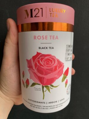 M21 Rose Tea being held by a hand