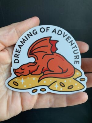orange dragon on a pile of gold, dreaming of adventure sticker