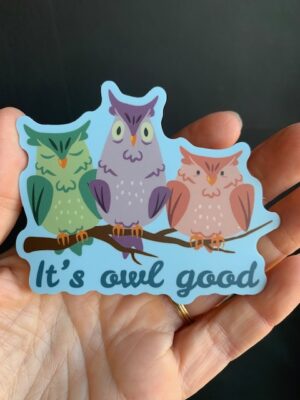 sticker with three owls, green, purple and orange on a branch with it's owl good