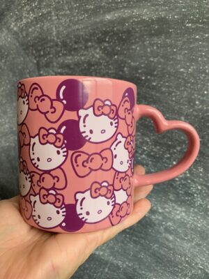 Pink Hello Kitty mug with a heart shaped handle