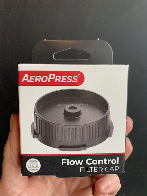 AeroPress Flow Control Filter Cap being held by a hand