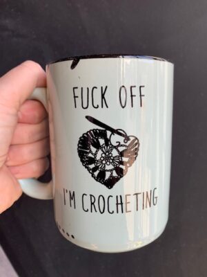 Prairie Chick Mug in green with Fuck off I'm crocheting