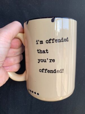 Prairie Chick Mug in yellow with "I'm Offended that Your Offended"