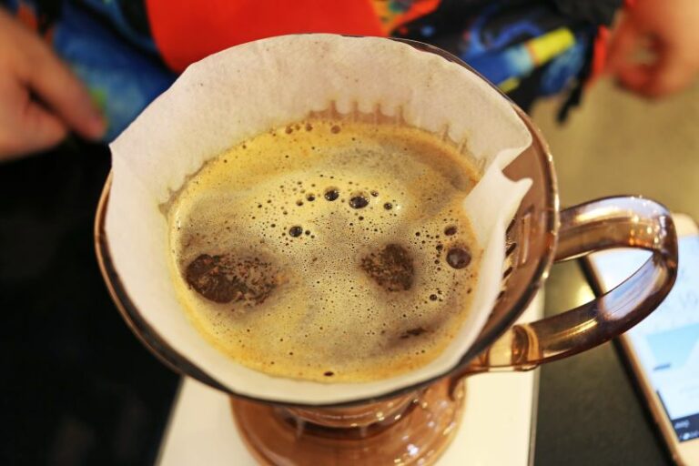 Fresh coffee bloom in the top of a pourover