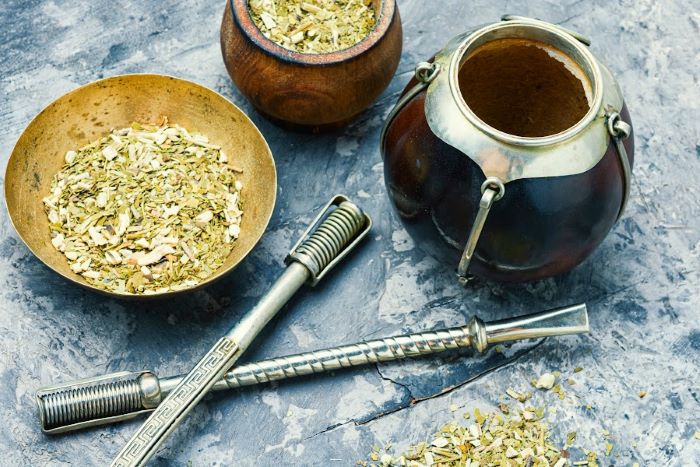 Bombillas, yerba mate gourds, and a bowl of yerba mate