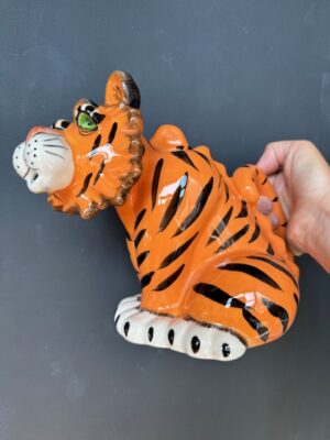 a hand holding a Blue Sky Clayworks Tiger Teapot
