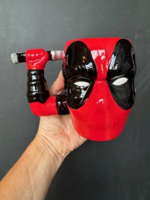 Mug with Marvel's Deadpool head with an arm drawing a katana sword