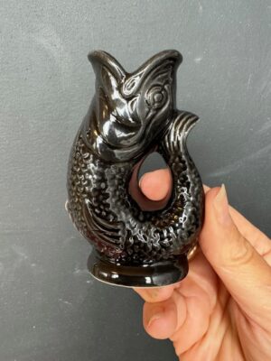 Mini Gluggle Jug in Black being held by a hand
