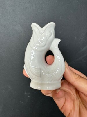 Mini Gluggle Jug in White being held by a hand