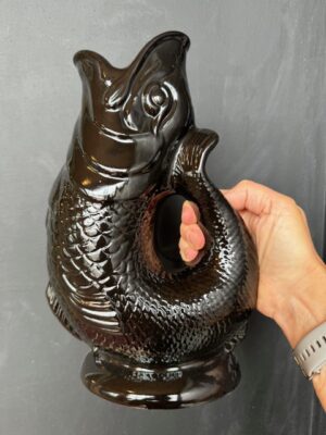Extra large Gluggle Jug in Black being held by a hand