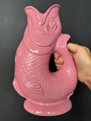 Extra large Gluggle Jug in Pink being held by a hand