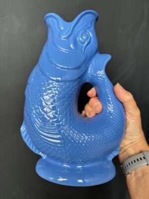 Extra large Gluggle Jug in Sea Blue being held by a hand