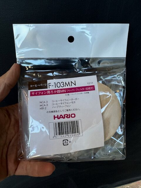 Hario Syphon Coffee Brewer filters and screen front of package